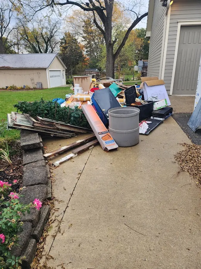 Dumpster being loaded with debris for Residential Dumpster Rental in Huntingburg